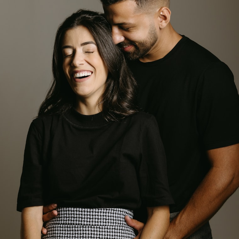 Two people sharing a genuine laugh together